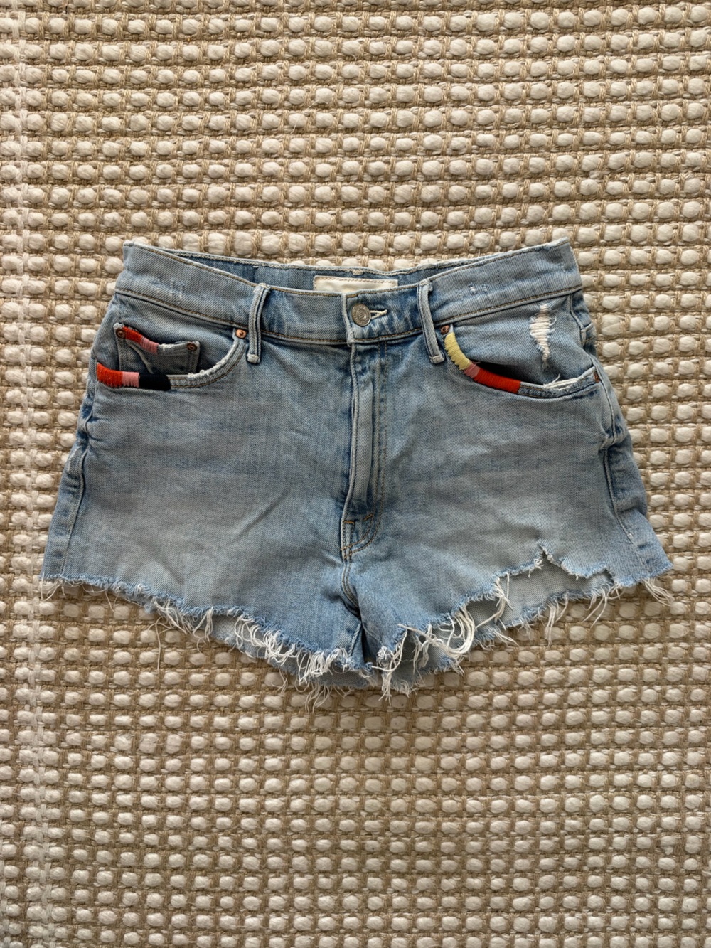 MOTHER Light Blue Denim Cutoff Shorts with Red and Yellow Pocket Accents